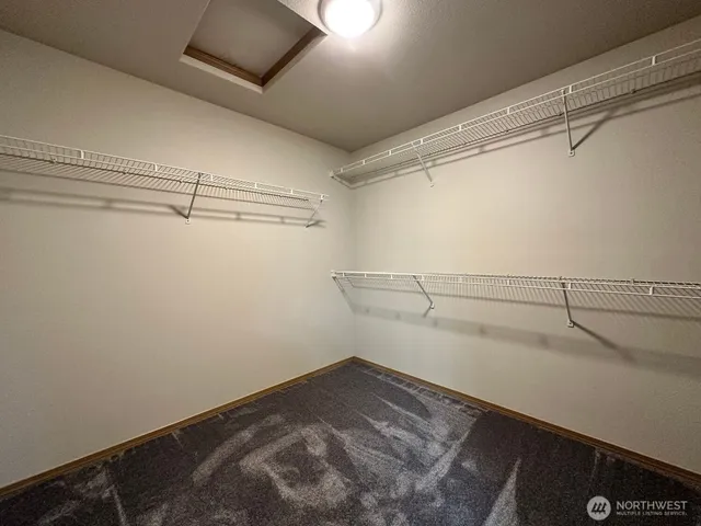 a view of a room with racks on the wall