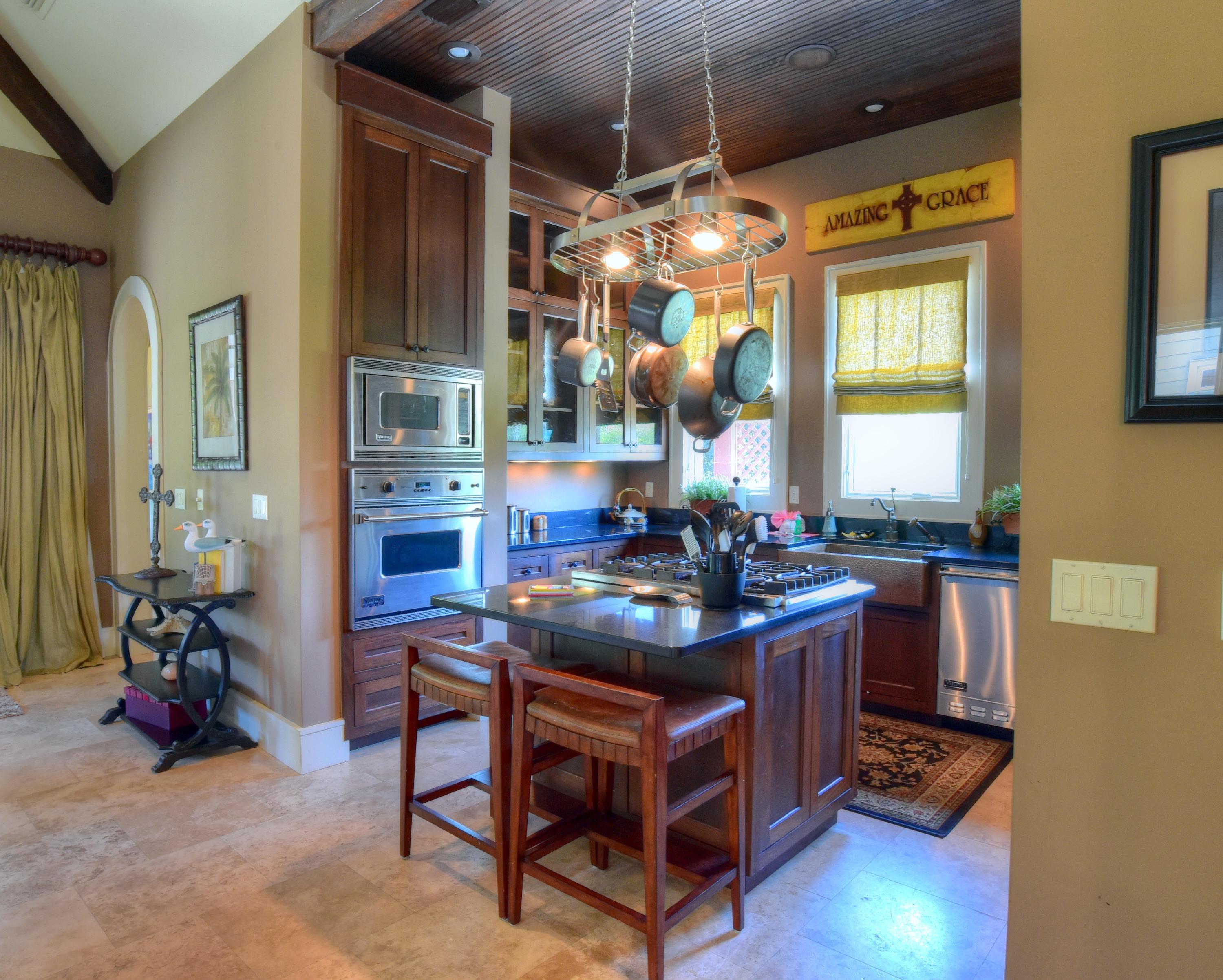 40 Rue Caribe Miramar Beach, FL 32550 - Photo 12 of 64 a kitchen with stainless steel appliances granite countertop a stove and a refrigerator