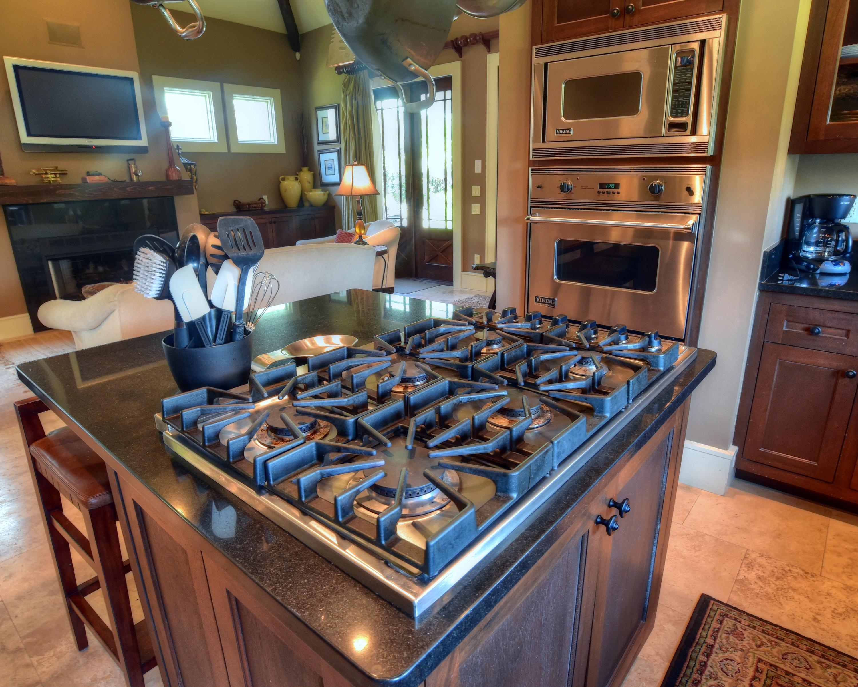 40 Rue Caribe Miramar Beach, FL 32550 - Photo 18 of 64 a kitchen with stainless steel appliances granite countertop a stove and a microwave