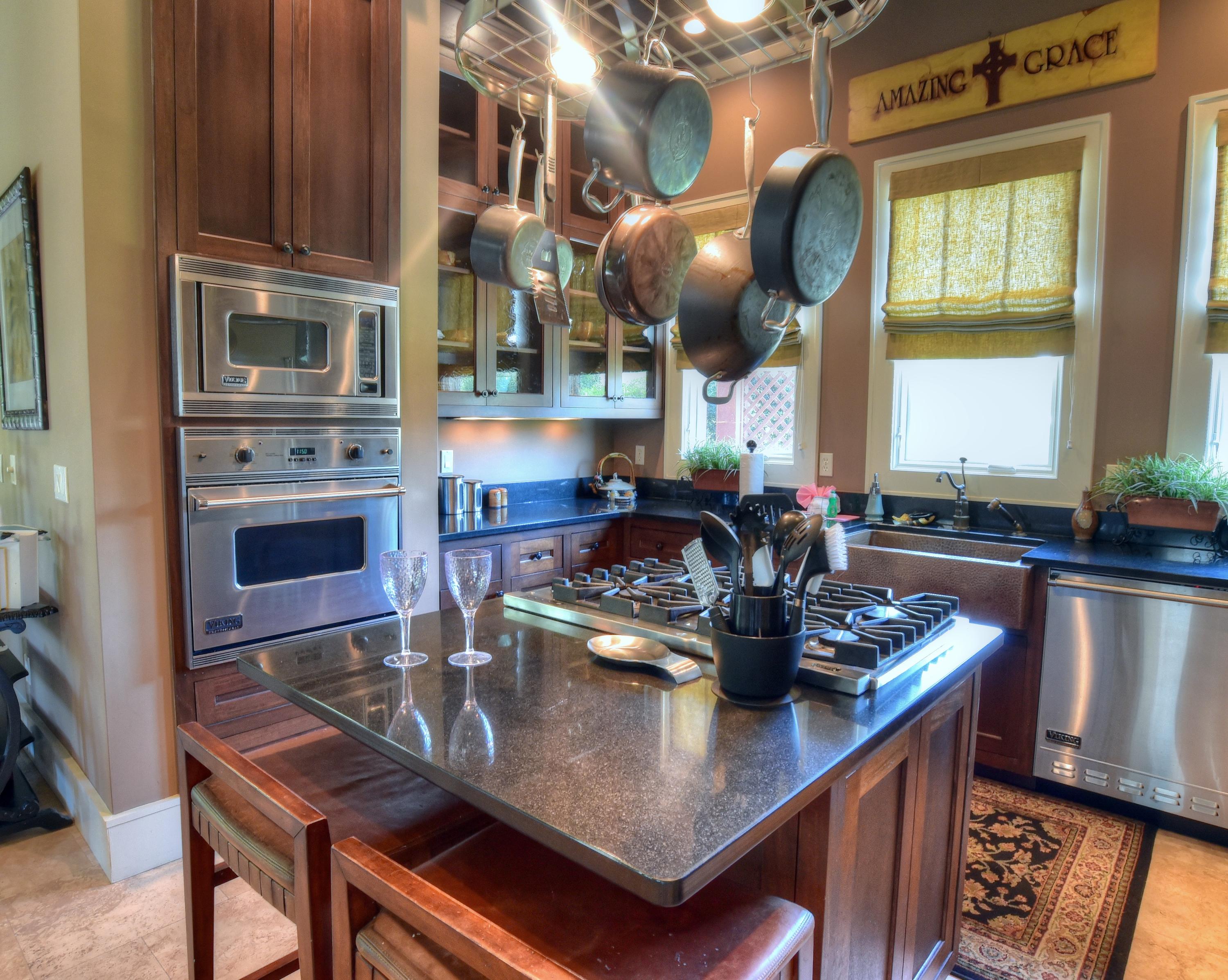 40 Rue Caribe Miramar Beach, FL 32550 - Photo 20 of 64 a kitchen with stainless steel appliances granite countertop a sink a stove and a microwave