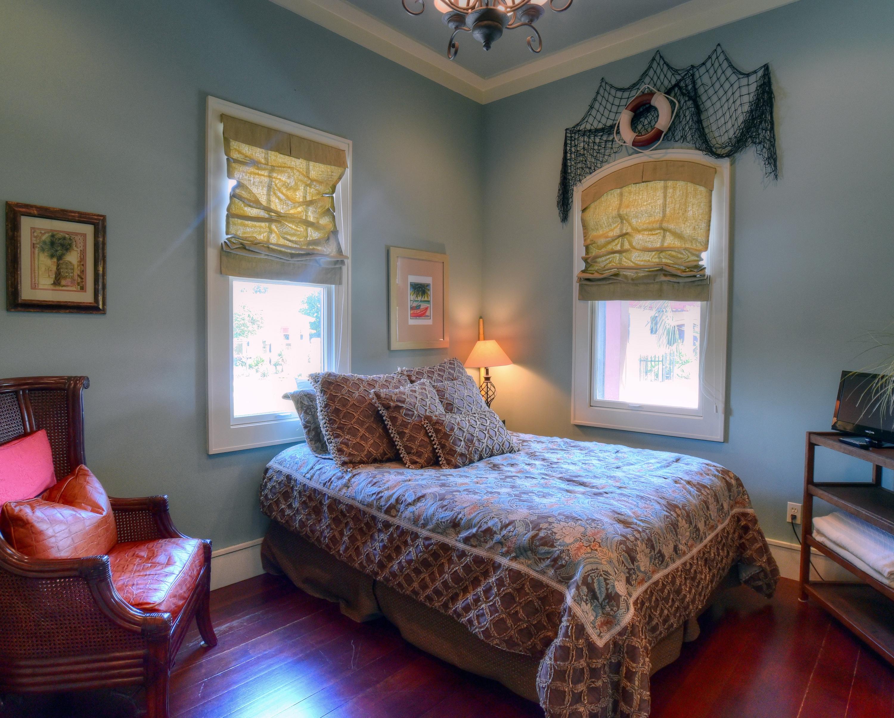 40 Rue Caribe Miramar Beach, FL 32550 - Photo 24 of 64 a bedroom with a bed chair and a window