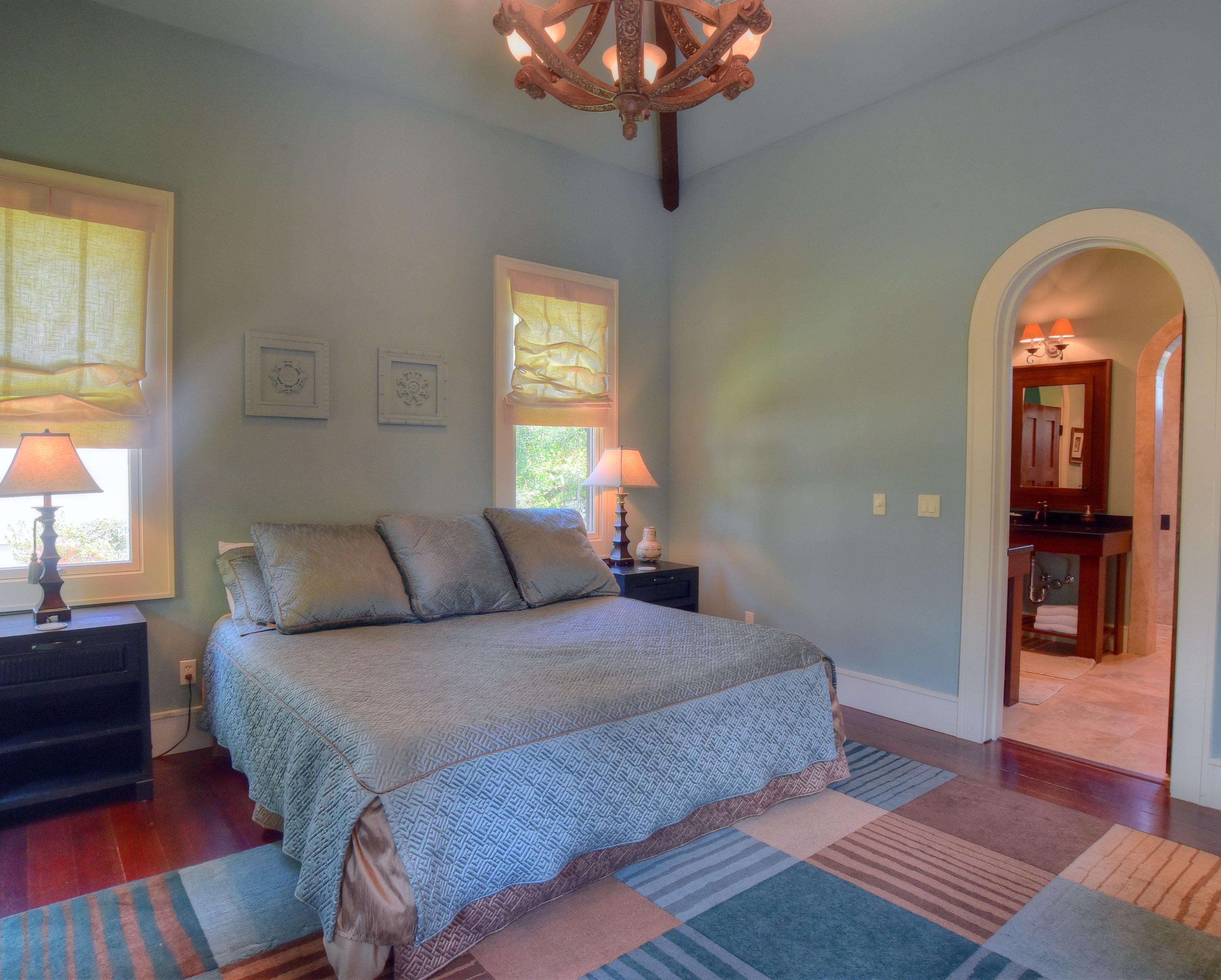 40 Rue Caribe Miramar Beach, FL 32550 - Photo 41 of 64 a bedroom with a large bed and a chandelier