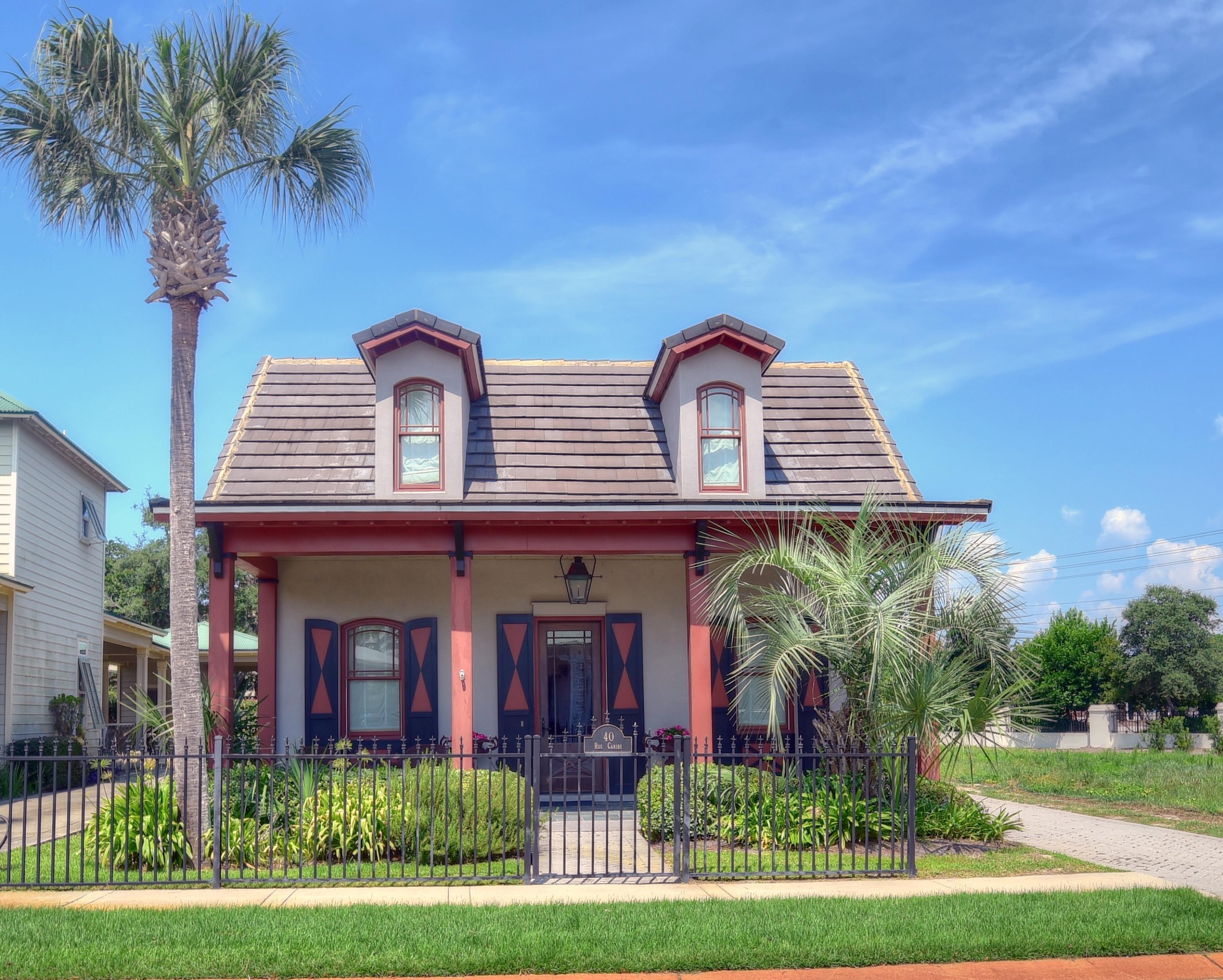 40 Rue Caribe Miramar Beach, FL 32550 - Photo 55 of 64 a front view of a house with a garden
