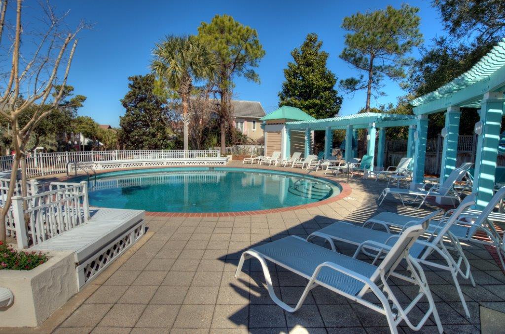 40 Rue Caribe Miramar Beach, FL 32550 - Photo 60 of 64 a view of a patio with couches table and chairs and potted plants