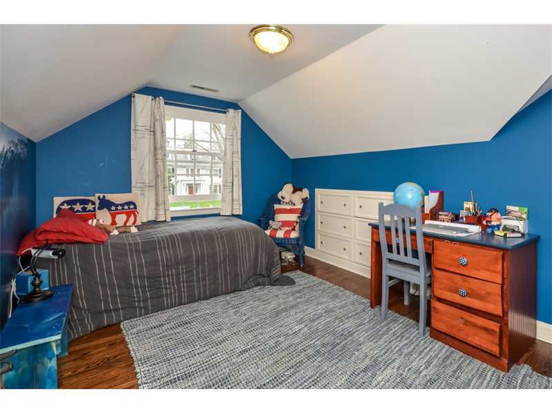 16 Willow Road Riverside, CT 06878 - Photo 17 of 24 a bedroom with a bed and wooden floor