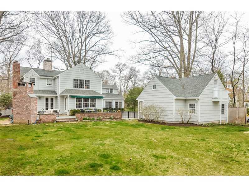 16 Willow Road Riverside, CT 06878 - Photo 2 of 24 a big house with a big yard and large trees