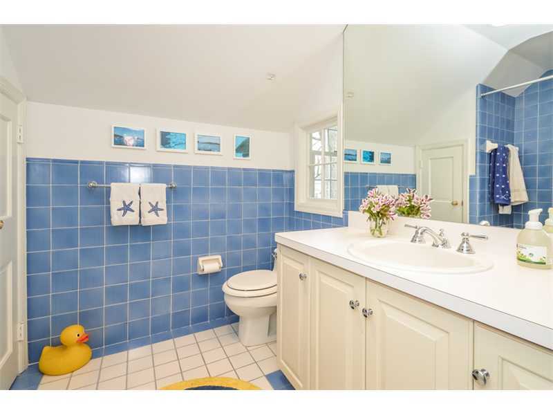 16 Willow Road Riverside, CT 06878 - Photo 22 of 24 a bathroom with a sink toilet and mirror