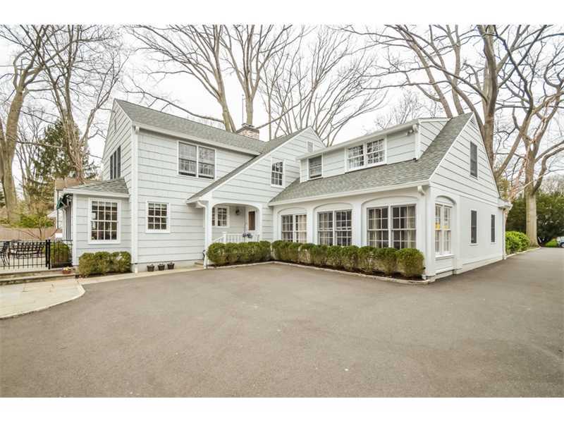 16 Willow Road Riverside, CT 06878 - Photo 4 of 24 a view of a white house with a large tree in front of it