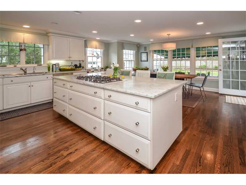 16 Willow Road Riverside, CT 06878 - Photo 10 of 24 a kitchen with granite countertop a stove and cabinets