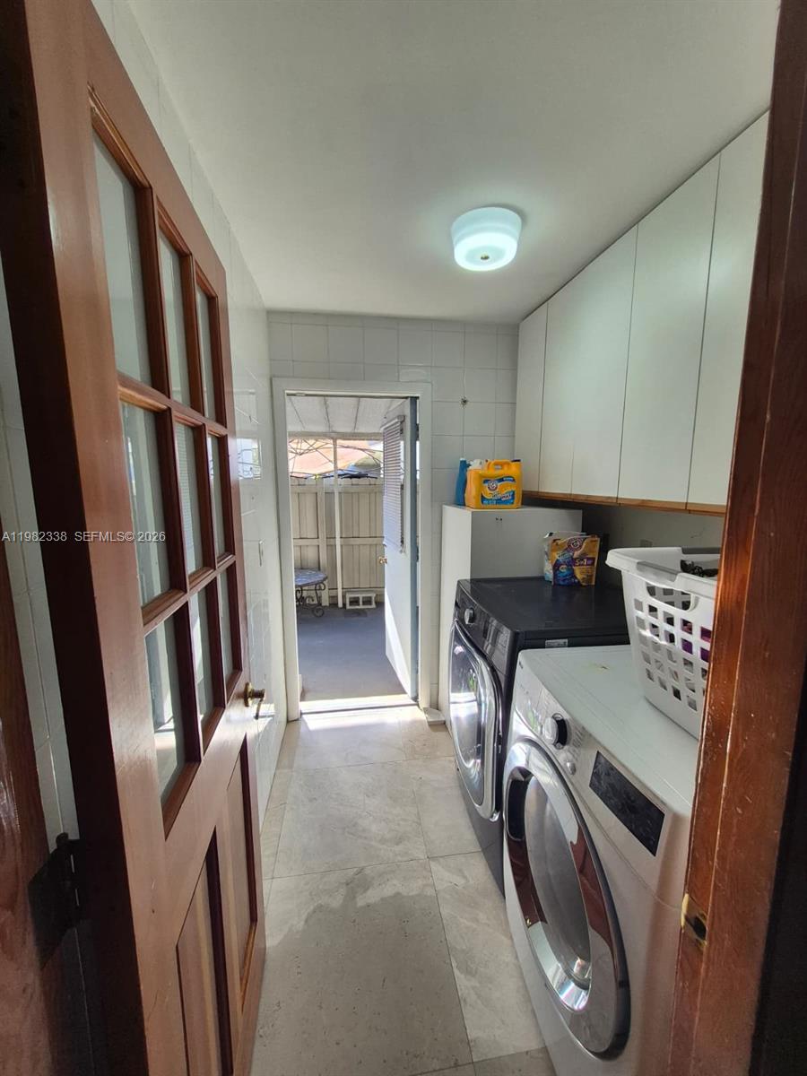 14530 Southwest 110th Street Miami, FL 33186 - Photo 34 of 45 a view of storage and utility room with refrigerator