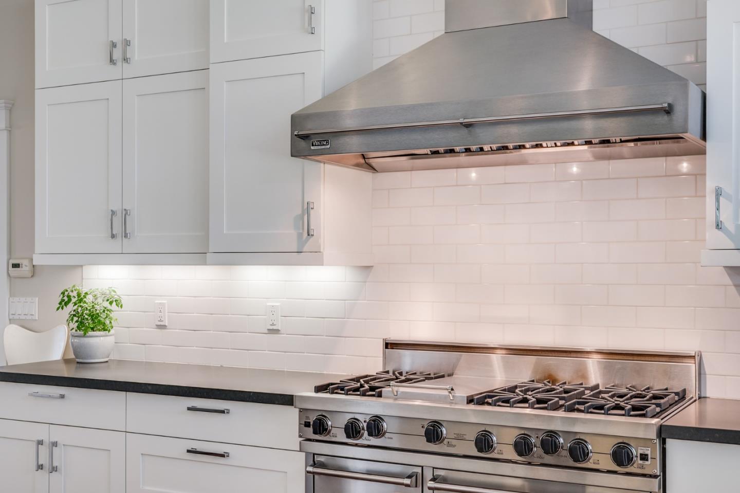2533 Hayward Drive Burlingame, CA 94010 - Photo 14 of 47 a stove top oven sitting inside of a kitchen