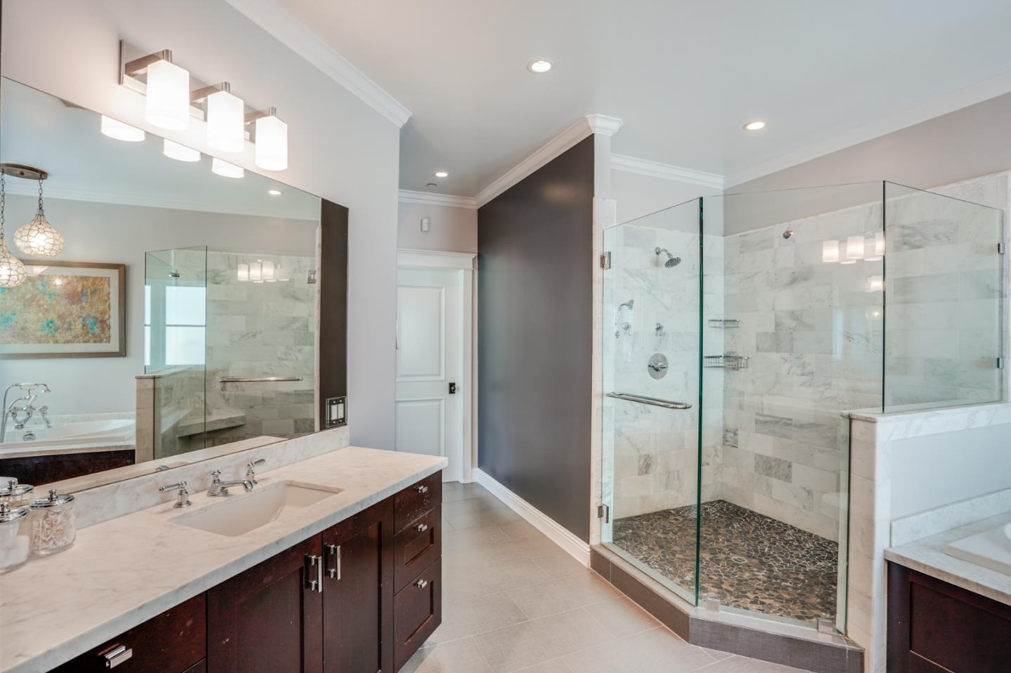 2533 Hayward Drive Burlingame, CA 94010 - Photo 25 of 47 a bathroom with a shower sink and mirror