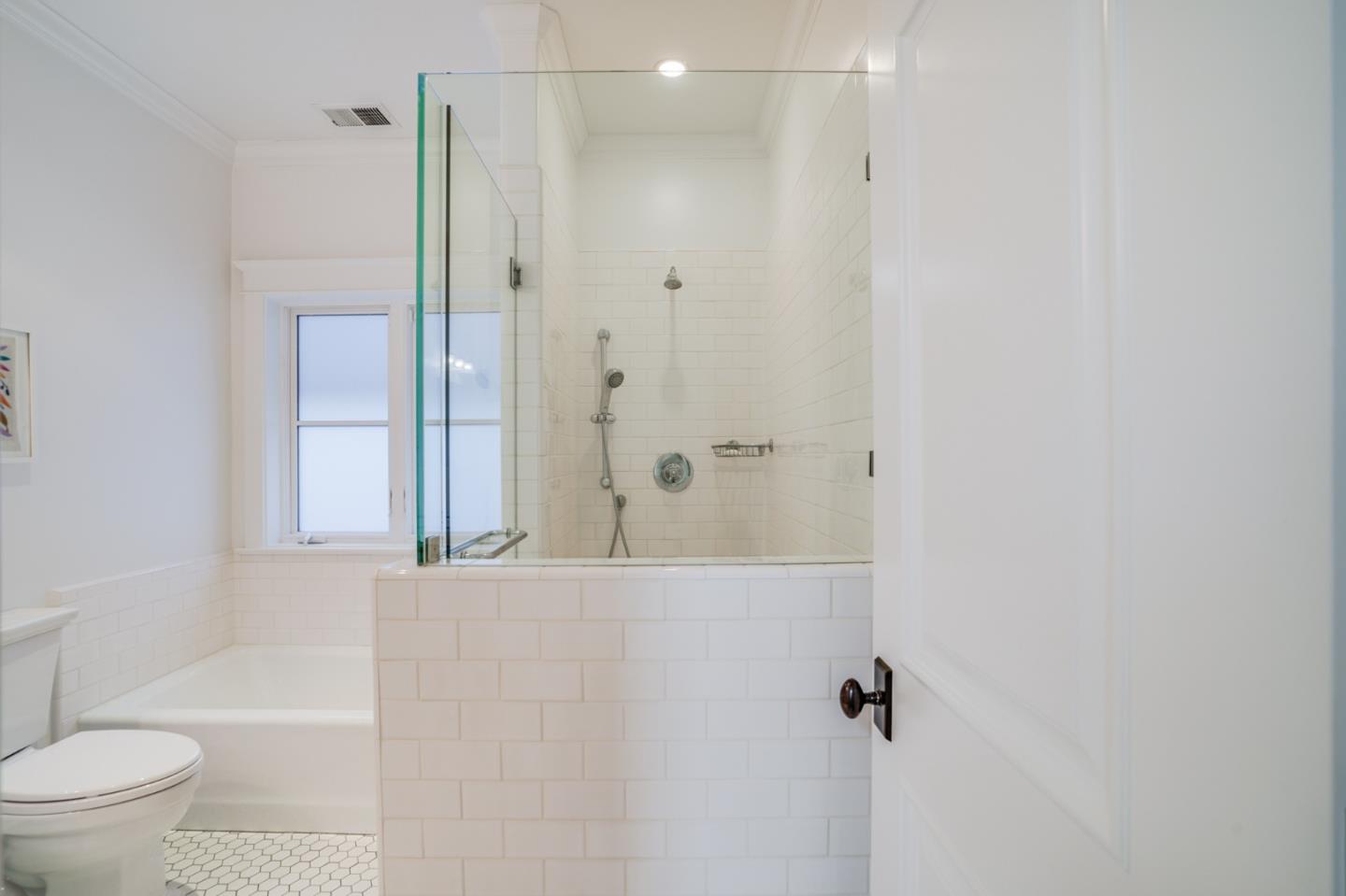 2533 Hayward Drive Burlingame, CA 94010 - Photo 30 of 47 a bathroom with a shower curtain and a toilet