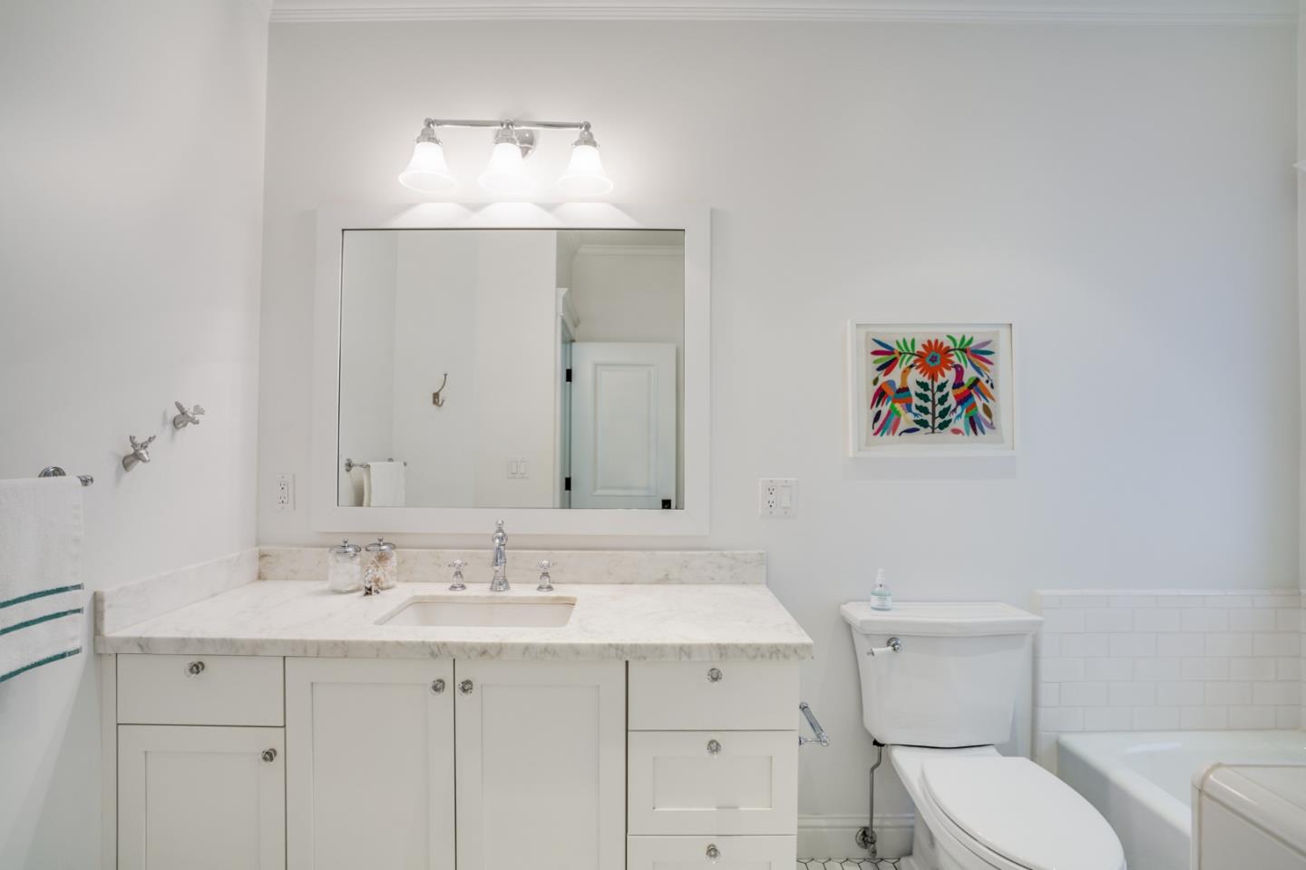 2533 Hayward Drive Burlingame, CA 94010 - Photo 34 of 47 a bathroom with a toilet a sink and mirror