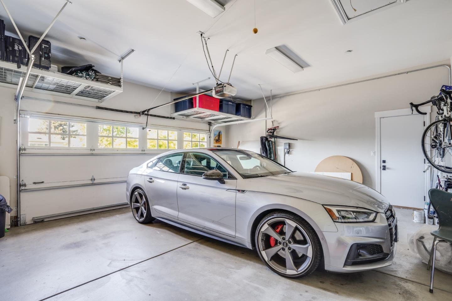 2533 Hayward Drive Burlingame, CA 94010 - Photo 47 of 47 a car and bike parked in a garage