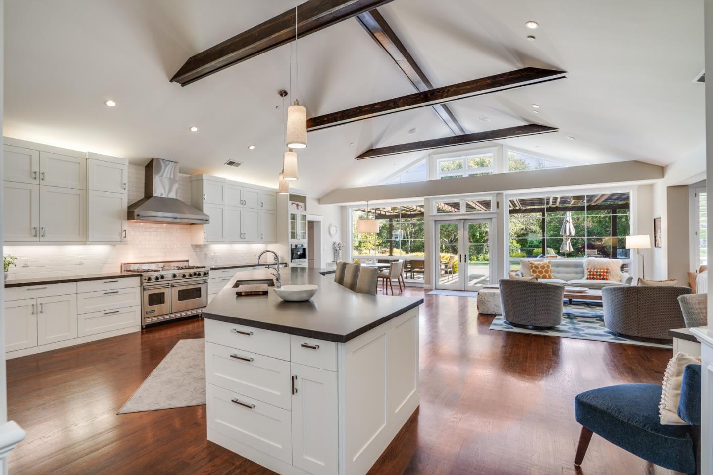 2533 Hayward Drive Burlingame, CA 94010 - Photo 9 of 47 a kitchen with stainless steel appliances granite countertop a stove and a view of living room