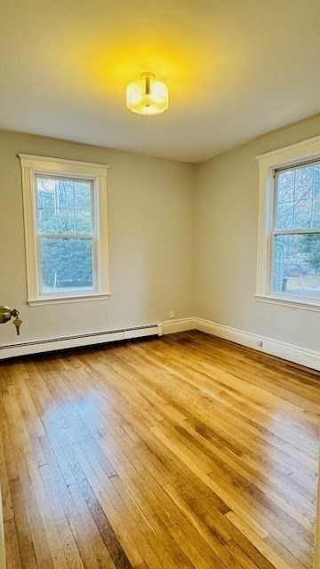 218 Wachusett Street, Unit 1 Boston, MA 02130 - Photo 12 of 21 a view of a room with wooden floor and a window