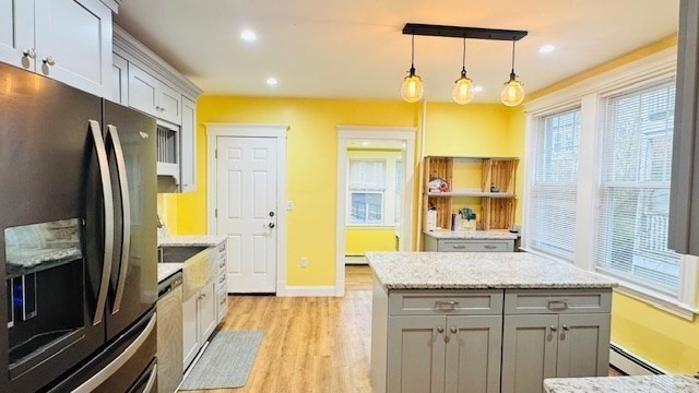 218 Wachusett Street, Unit 1 Boston, MA 02130 - Photo 2 of 21 a bathroom with a granite countertop sink and a mirror