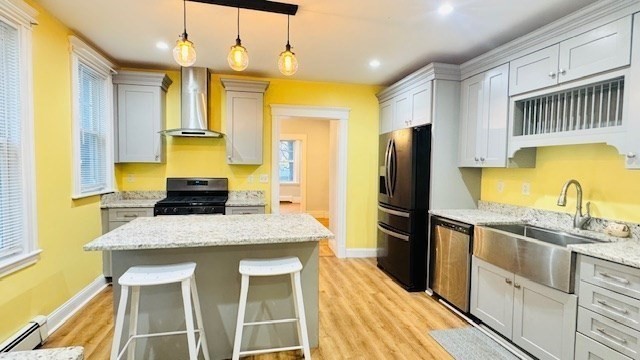 218 Wachusett Street, Unit 1 Boston, MA 02130 - Photo 3 of 21 a kitchen with a sink stove and refrigerator