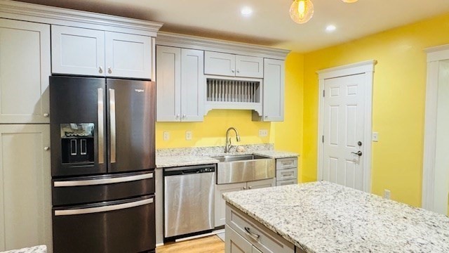 218 Wachusett Street, Unit 1 Boston, MA 02130 - Photo 4 of 21 a kitchen with stainless steel appliances granite countertop a refrigerator and a stove