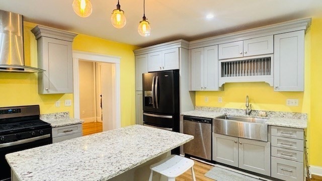 218 Wachusett Street, Unit 1 Boston, MA 02130 - Photo 5 of 21 a kitchen with a refrigerator and stove