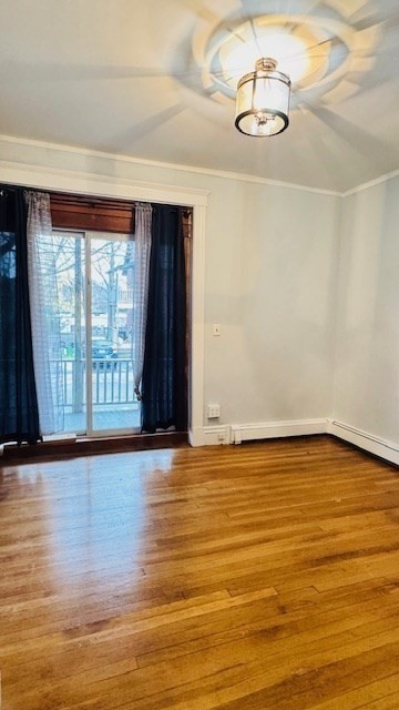 218 Wachusett Street, Unit 1 Boston, MA 02130 - Photo 9 of 21 a view of an empty room with wooden floor and a window