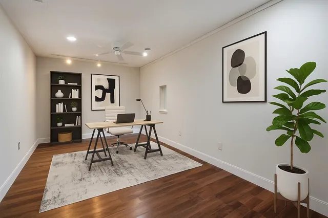 a work room with furniture and wooden floor