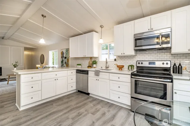 a spacious bathroom with a double vanity sink and a mirror