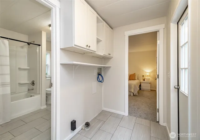 a bedroom with a bed and a couch