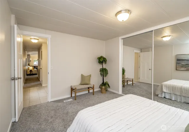 a view of a house with backyard and a tree