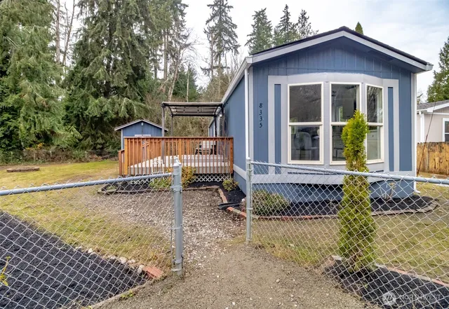 a view of front of house with a yard