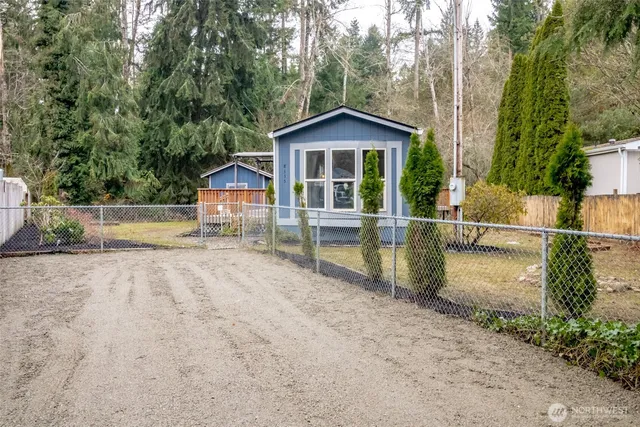 a kitchen with stove a sink and a refrigerator