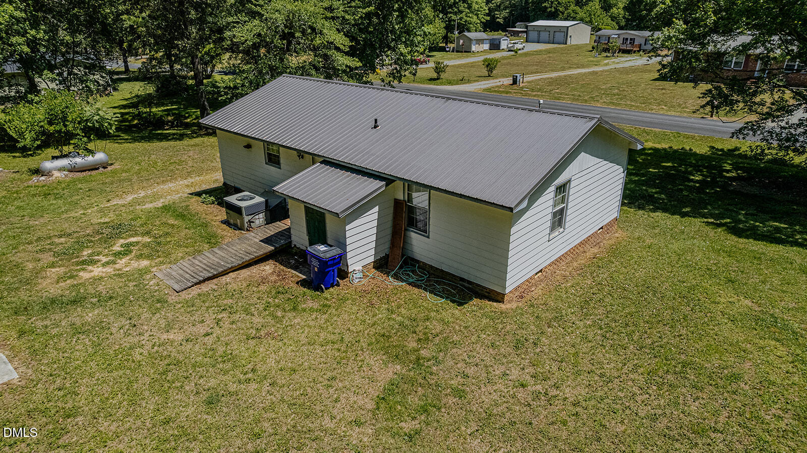1302 Blacksmith Road Efland, NC 27243 - Photo 43 of 46 a view of a house with pool and yard