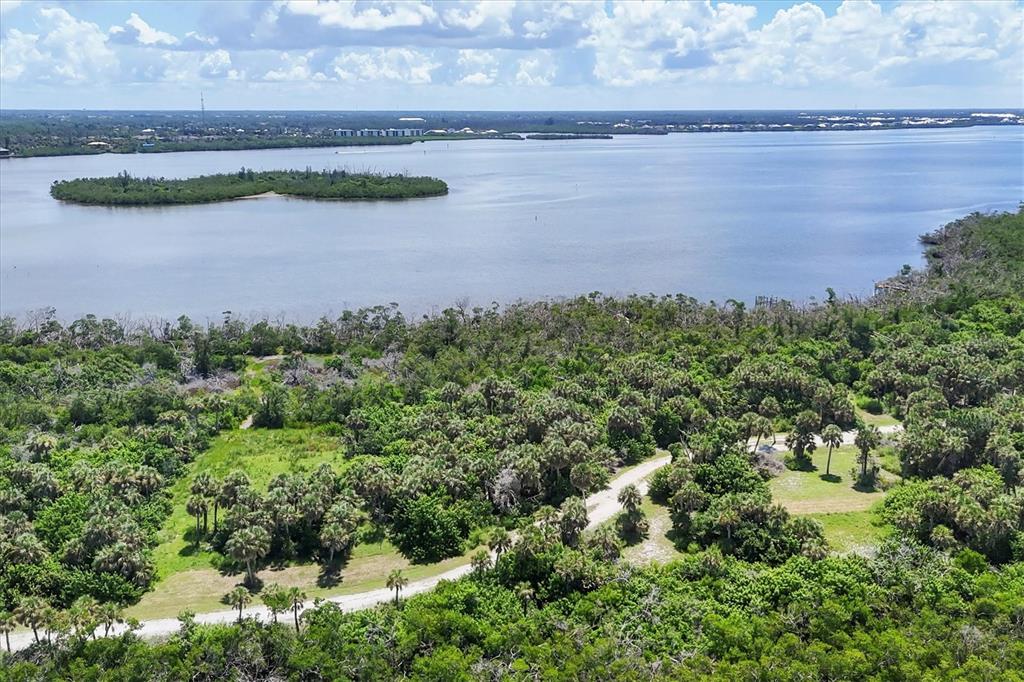 6040 Palm Point Way Boca Grande, FL 33921 - Photo 18 of 27 a view of a lake with outdoor space