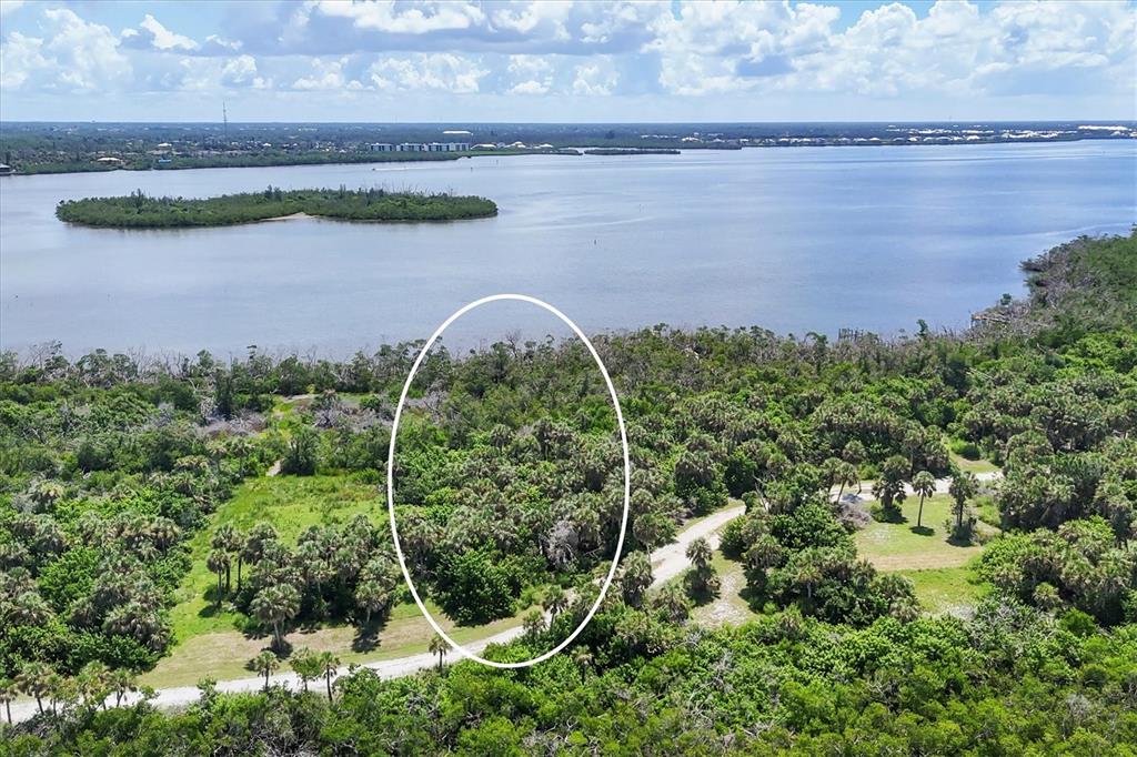 6040 Palm Point Way Boca Grande, FL 33921 - Photo 20 of 27 a view of a lake with a park