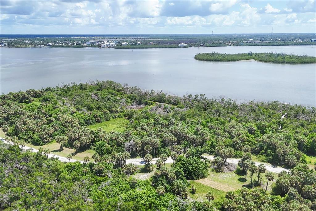 6040 Palm Point Way Boca Grande, FL 33921 - Photo 22 of 27 a view of a lake with outdoor space and a lake view in back