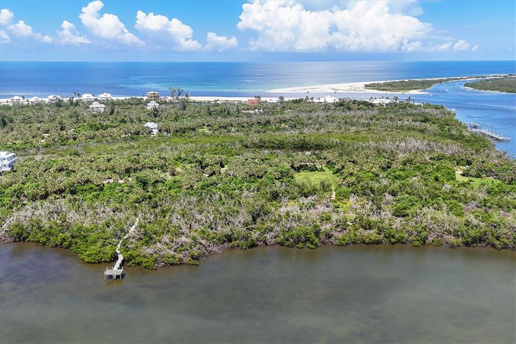 6040 Palm Point Way Boca Grande, FL 33921 - Photo 24 of 27 an aerial view of a houses with ocean view