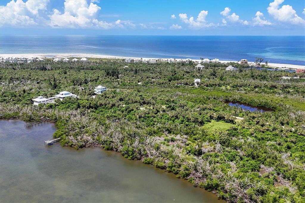 6040 Palm Point Way Boca Grande, FL 33921 - Photo 25 of 27 a view of a field with an ocean