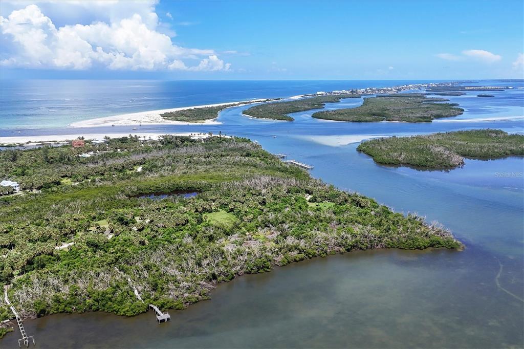 6040 Palm Point Way Boca Grande, FL 33921 - Photo 26 of 27 an aerial view of a houses with a yard