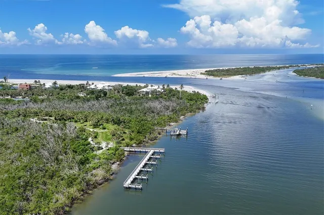 a view of a street with an ocean