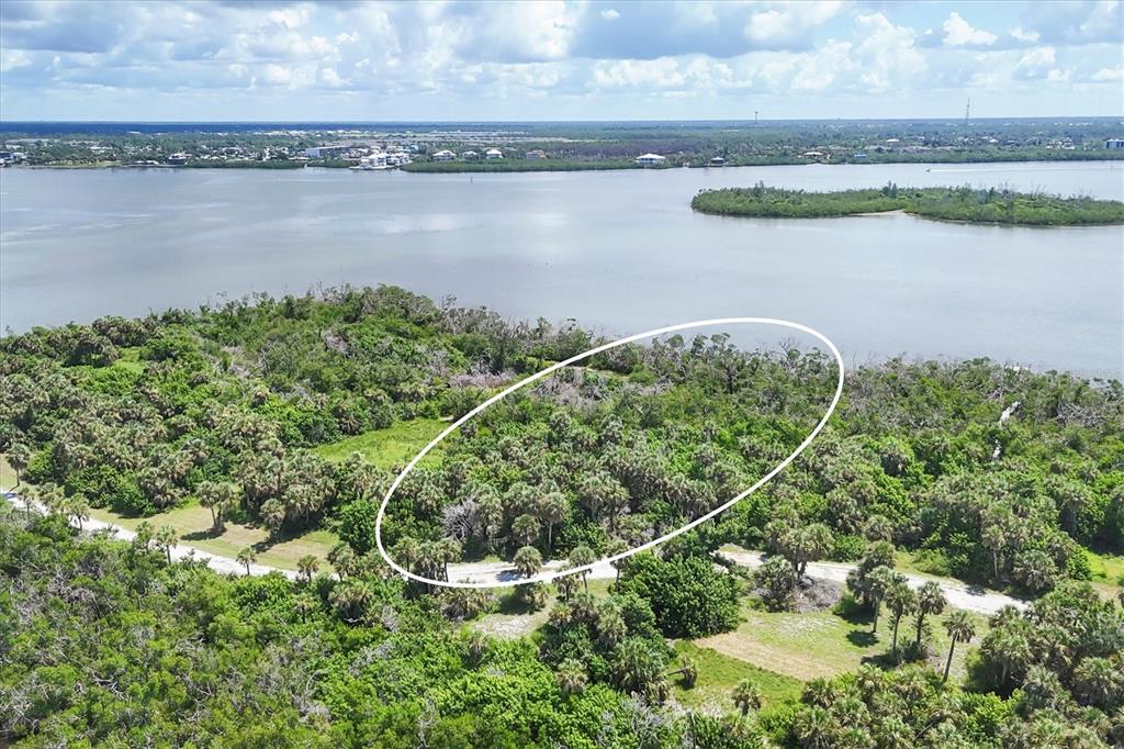 6040 Palm Point Way Boca Grande, FL 33921 - Photo 9 of 27 a view of a lake with a outdoor space