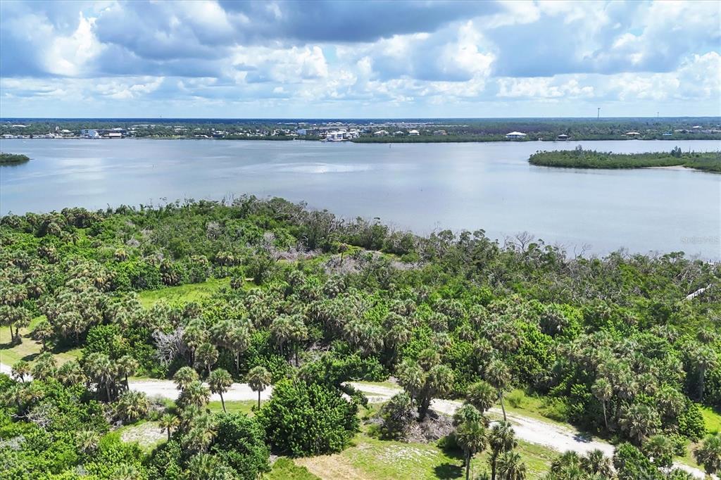 6040 Palm Point Way Boca Grande, FL 33921 - Photo 10 of 27 a view of a lake from a yard