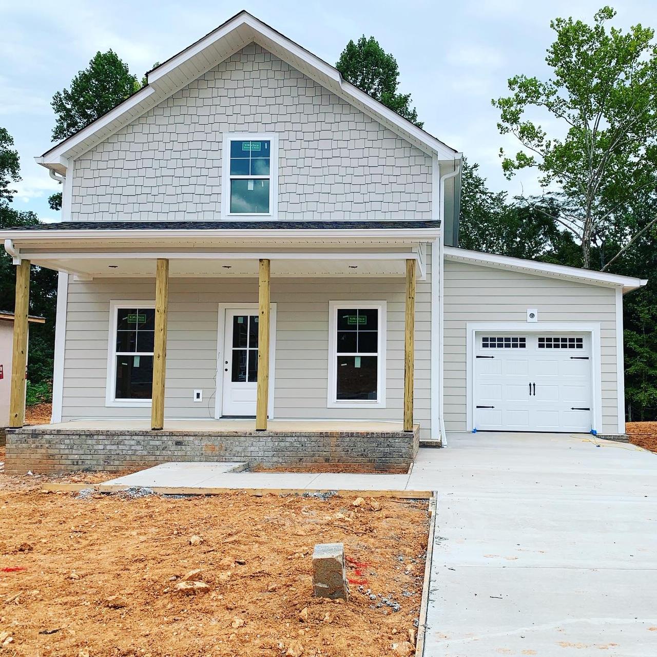 21 Sycamore Ridge West Burns, TN 37029 - Photo 2 of 13 a view of front of house with garage