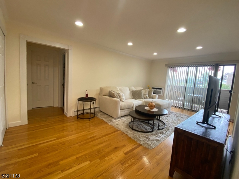 824 Main Street, Unit J Belleville, NJ 07109 - Photo 10 of 24 a living room with furniture and a table