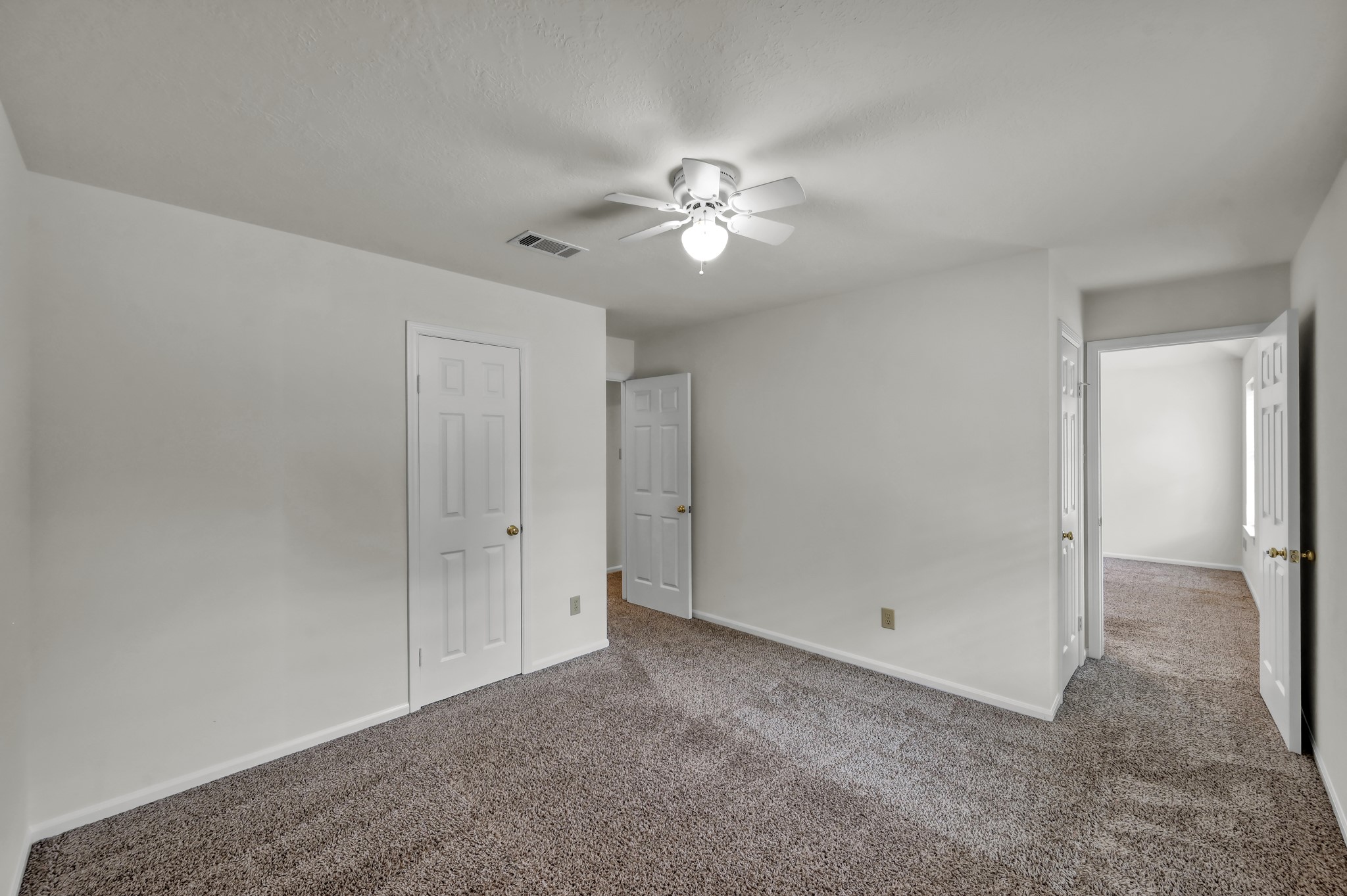 114 Regency Way Conroe, TX 77304 - Photo 31 of 48 Bedroom #2 of 5 adjacent to Primary bedroom. Great for home office or nursery.