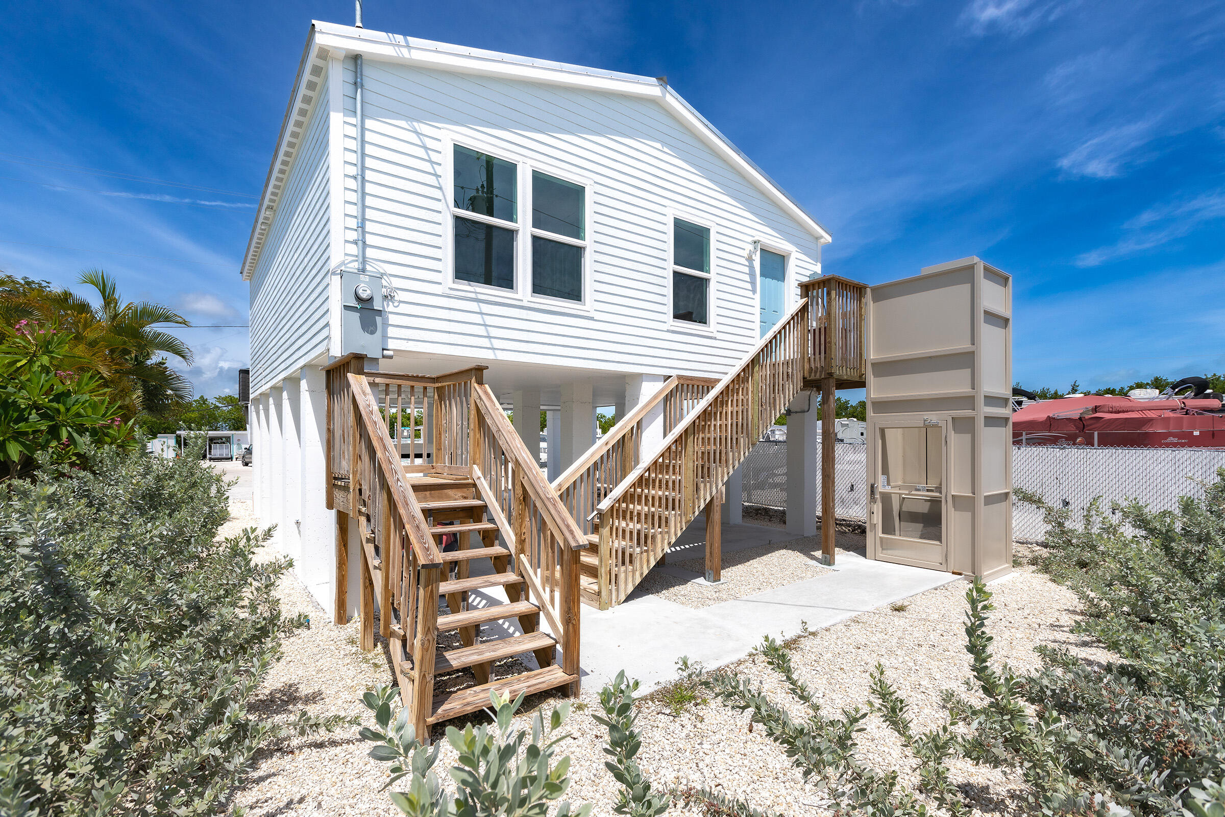 55 Boca Chica Road, Unit 27 Key West, FL 33040 - Photo 1 of 20 a view of a house with wooden stairs