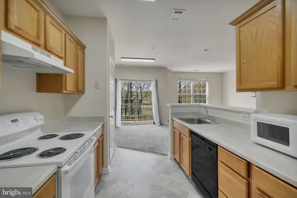 a kitchen with a stove and a sink