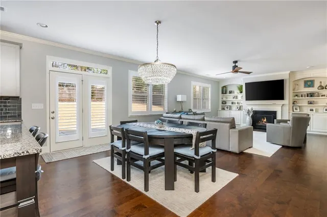 a bathroom with a granite countertop toilet sink and mirror