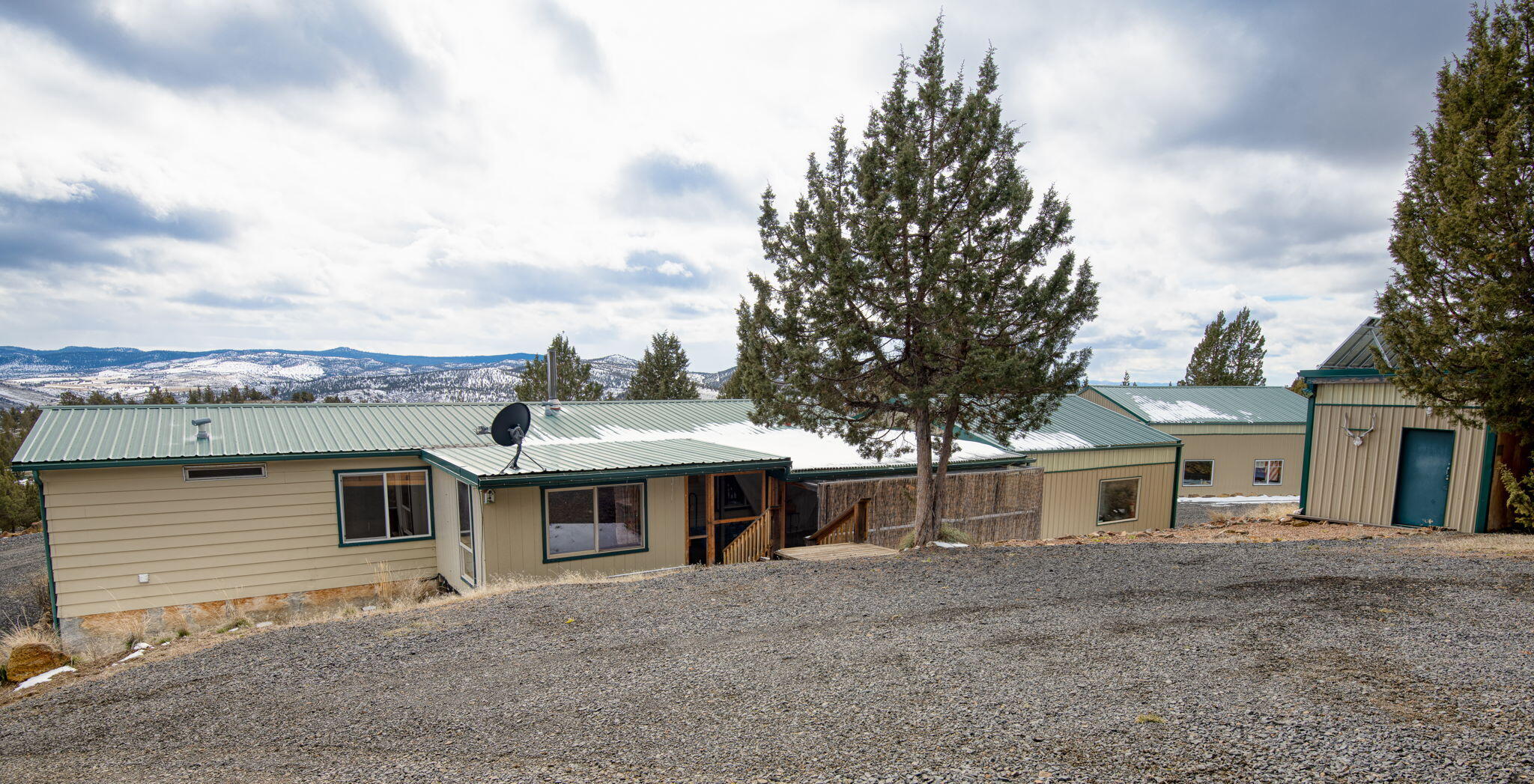 12312 Southeast Jack Rabbit Trail Prineville, OR 97754 - Photo 11 of 49 View of the back of the house, rear porch and electrical shed.