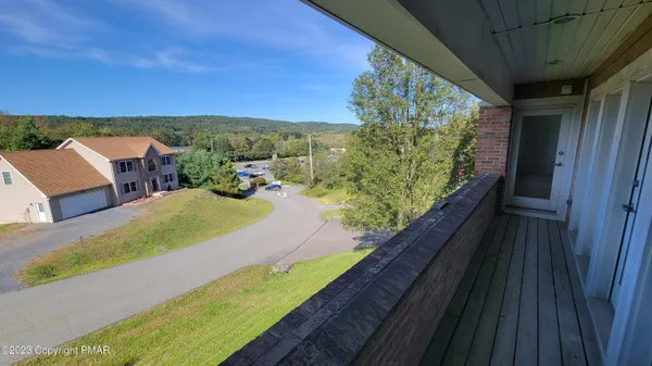 a view of balcony with furniture